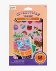 Package of Ooly Mini Cat Cafe Scented Stickers showing die-cut stickers with cat-themed designs, and a mini sticker sheet, predominantly pink and orange in color.