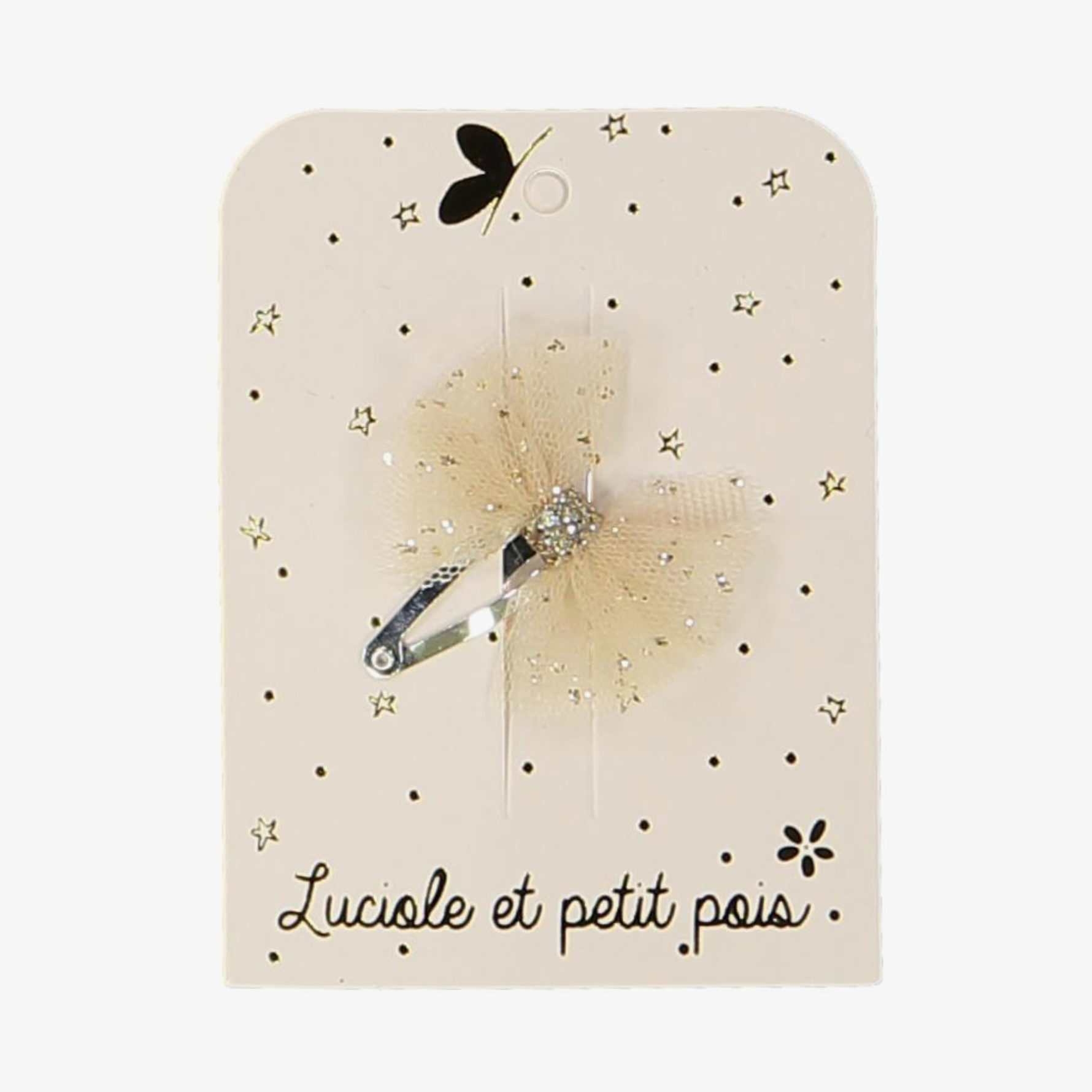 A beige hair clip with a tutu bow design, featuring stars and the text 'Luciole et Petit Pois'.