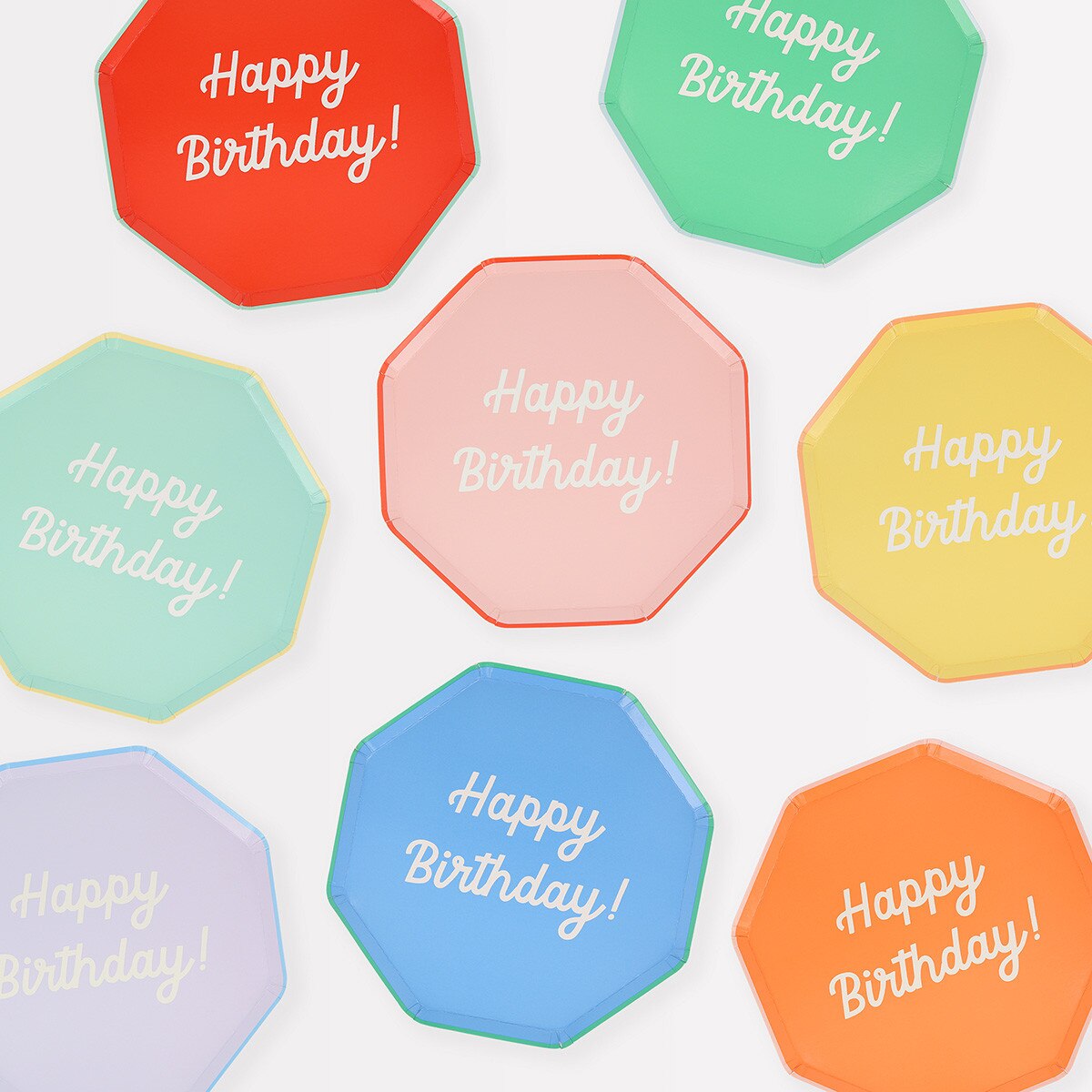 Octagonal plates with 'Happy Birthday!' text in various colors on a white background