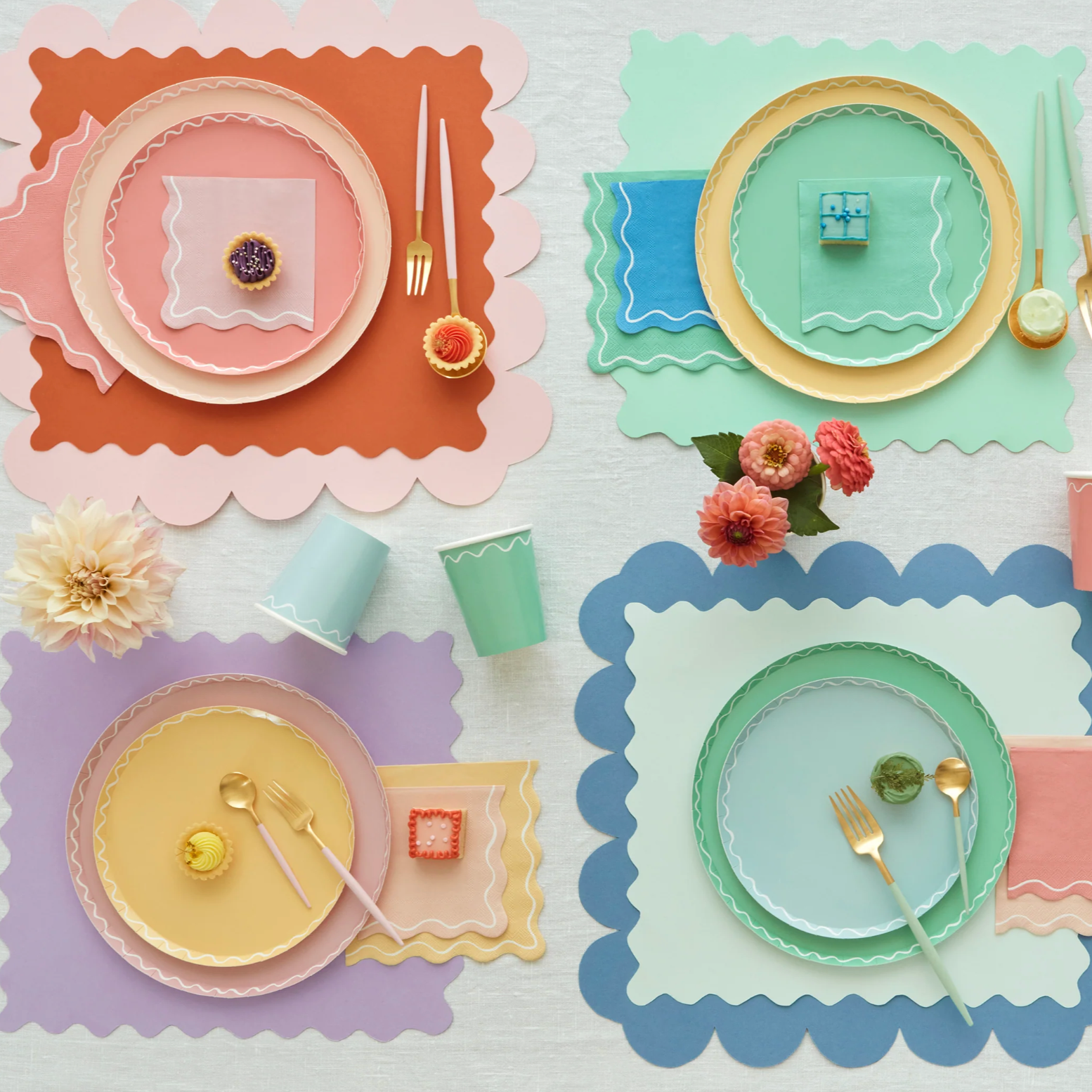 Rainbow table setting with placemats, paper plates and napkins.