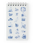 Small notebook with blue Moomin illustrations on a white background
