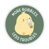 Circular sticker with a cartoon chick holding a boba drink and text 'More Bubbles Less Troubles' on a green background