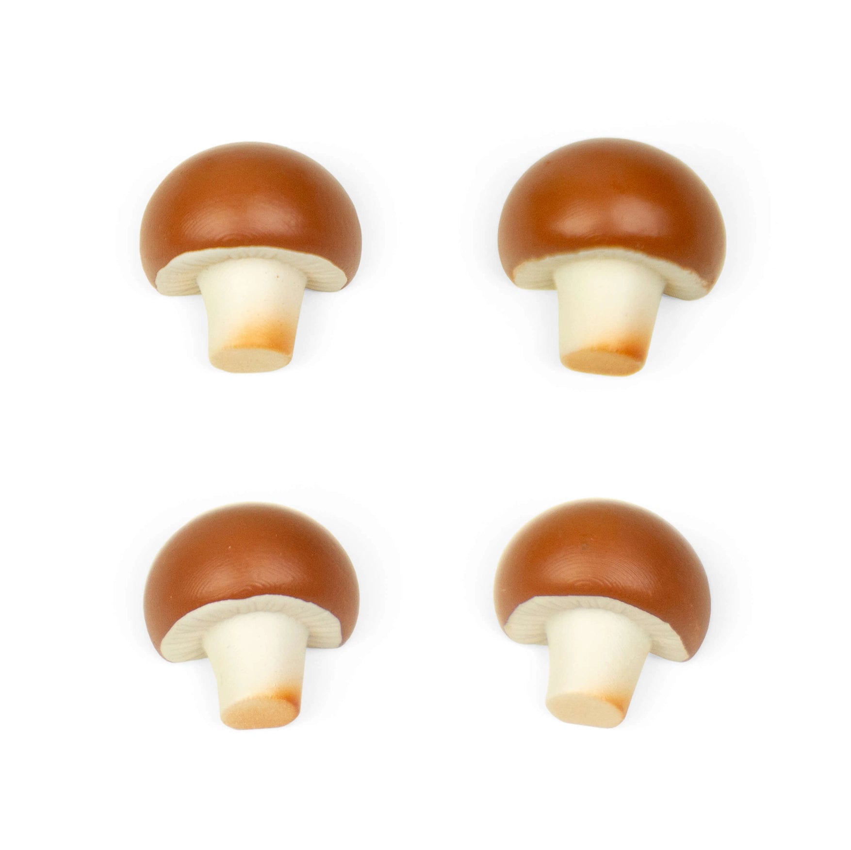 Four mushroom-shaped objects on a white background