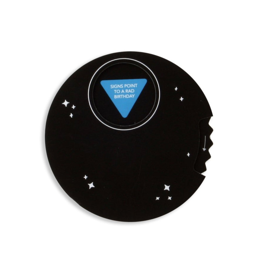 A greeting card in the shape of a magic ball and note that says "signs point to a rad birthday"