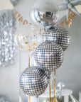 a set of round metallic balloons in silver, disco and confetti