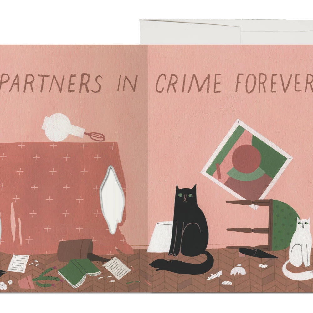 inside of a greeting card with cats in a messy room and text reading "partners in crime forever"