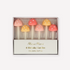 A set of six pastel mushroom-shaped candles in clear packaging with the brand 'Meri Meri' written on the box.