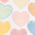 Pastel color paper plates in a heart shape with scallop trim on a white background