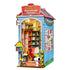 Peanuts and snoopy themed miniature house with library inside on white background