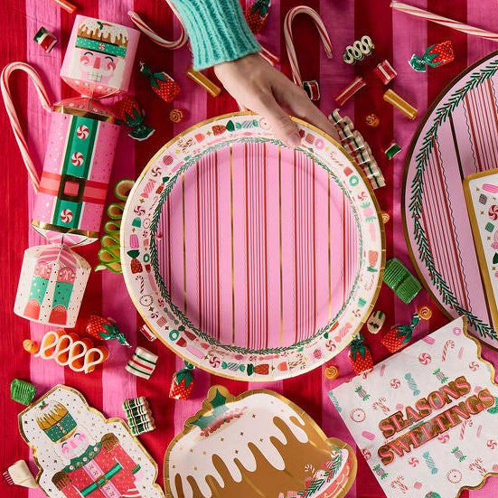 Decorative items including a pink plate, cookies, and a letter to Santa on a pink background.