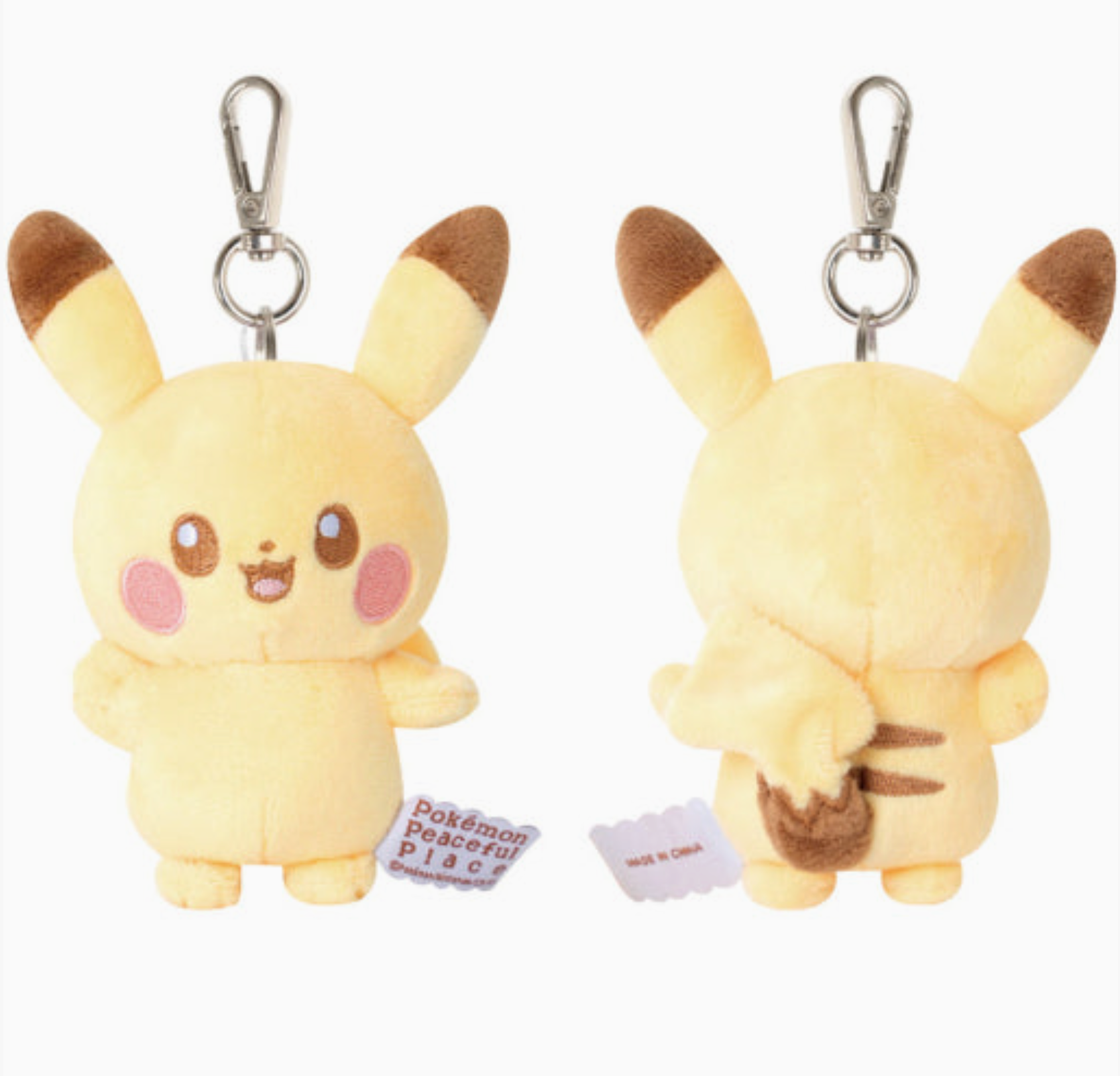Two plush Pikachu keychains with tags on a white background