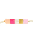 packaged paper streamers in shades of pinks and gold, wrapped in a clear packaging