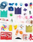 a spread of trinkets and toys that are can be found inside the heart pinata