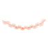 A pink-colored paper fan garland banner suspended horizontally against a solid white background.