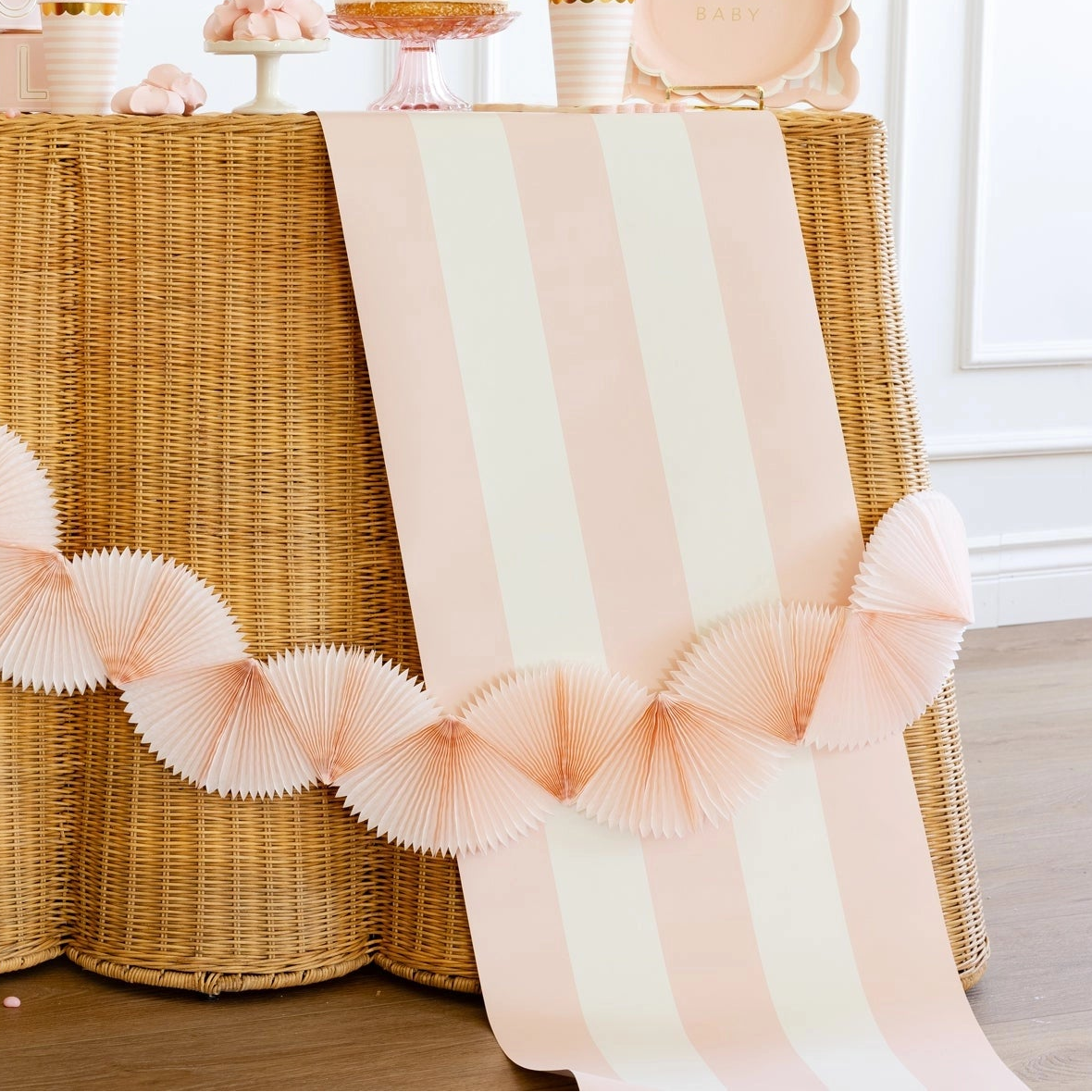 Decorated table with garland and striped cloth