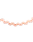 A pink-colored paper fan garland banner suspended horizontally against a solid white background.