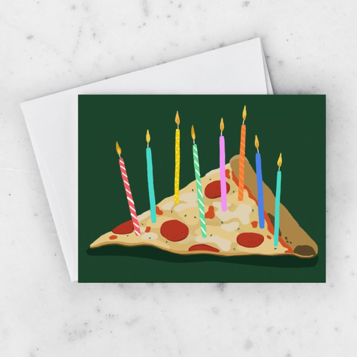 A greeting card featuring a cartoon illustration of a pizza with candles on it, representing a birthday celebration.
