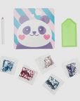 Inside contents of the Pretty Panda DIY Gem Art Kit with a visual of a panda face made of gems, gem trays, and wax pencil included.