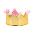 Gold crown with pink lining and pink pom-poms on a white background