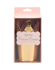 Packaged gold princess crowns with a pink box on a white background