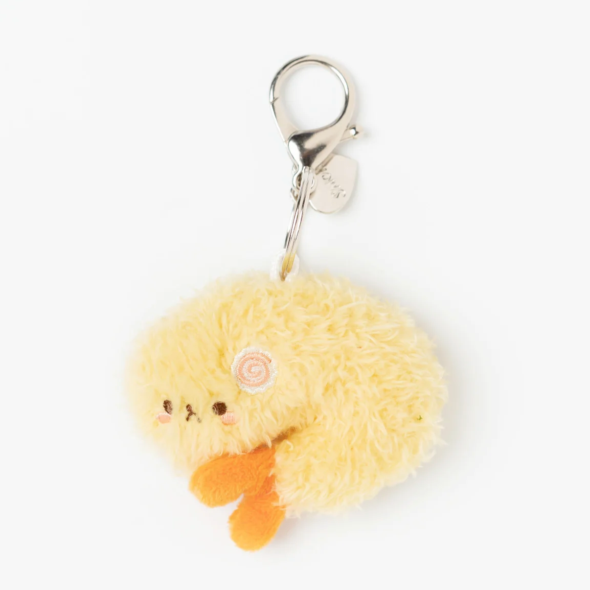 A yellow fluffy plush keychain charm shaped like a puppy &amp;  shrimp tempura with orange feet and a silver lobster clasp, shown on a plain white background.