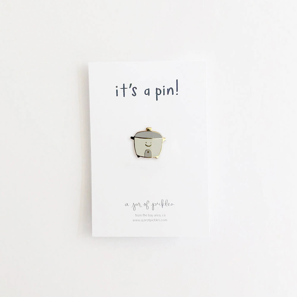 smiley rice cooker shaped pin on white background