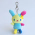 Plush keychain with a colorful bunny Sanrio character on a light blue background