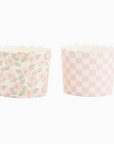 twp paper cups, one in pink floral and one in checkerboard print