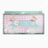 A package of a ribbon bunnies garland featuring two white bunny figures with blue and green ribbons, presented on a pink and white checkered background within a clear plastic box.