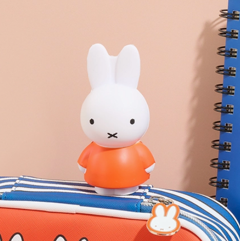 Miffy shaped stress ball with orange background
