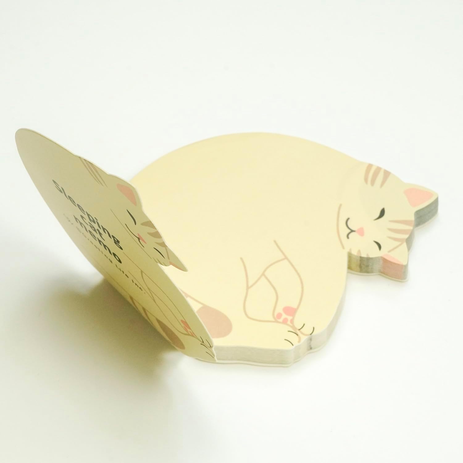 Cat-shaped sticky note pad on a white background