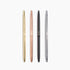Four metallic pens in gold, rose gold, black, and silver on a white background