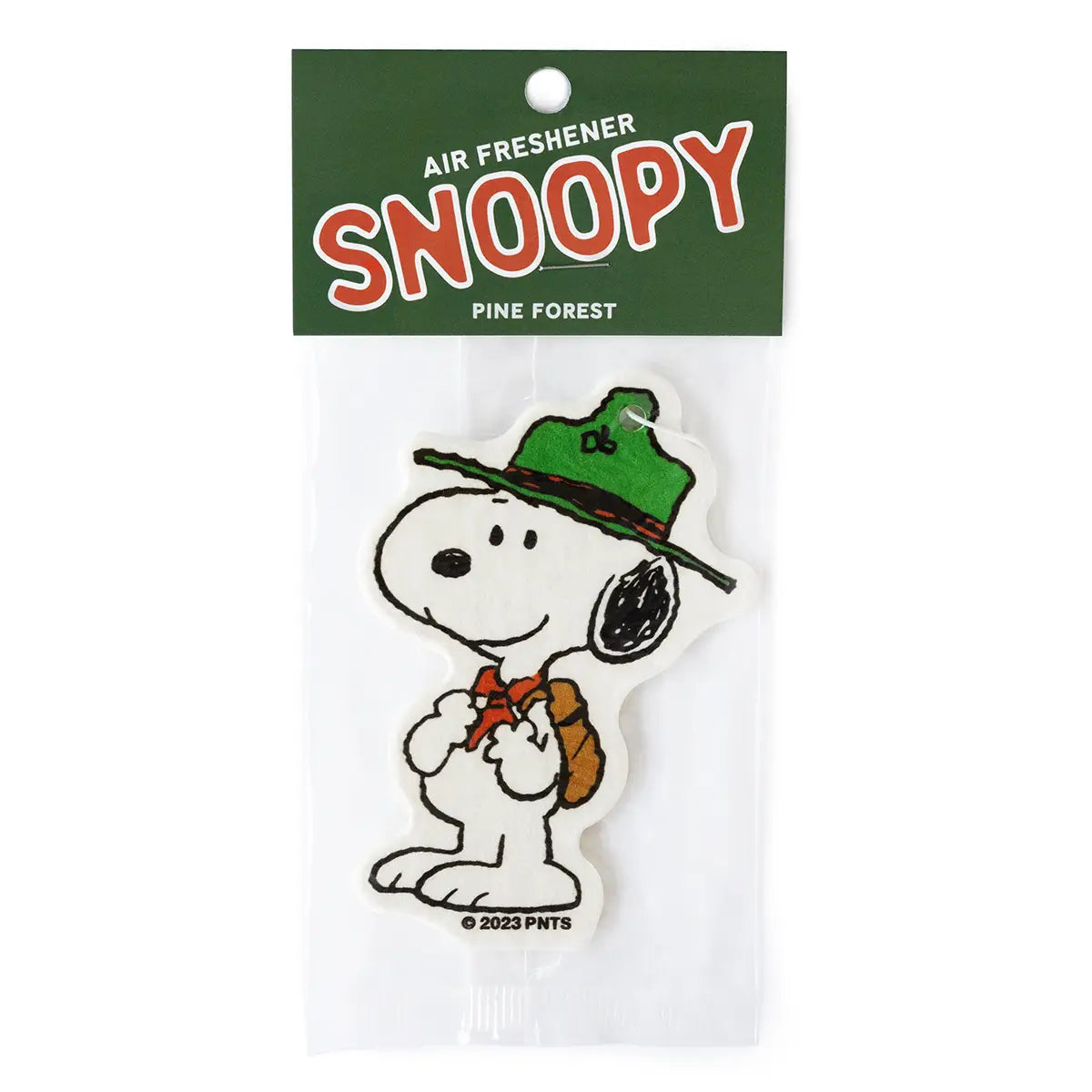 Scout Snoopy air freshener in packaging with green hat and brown backpack on a white background
