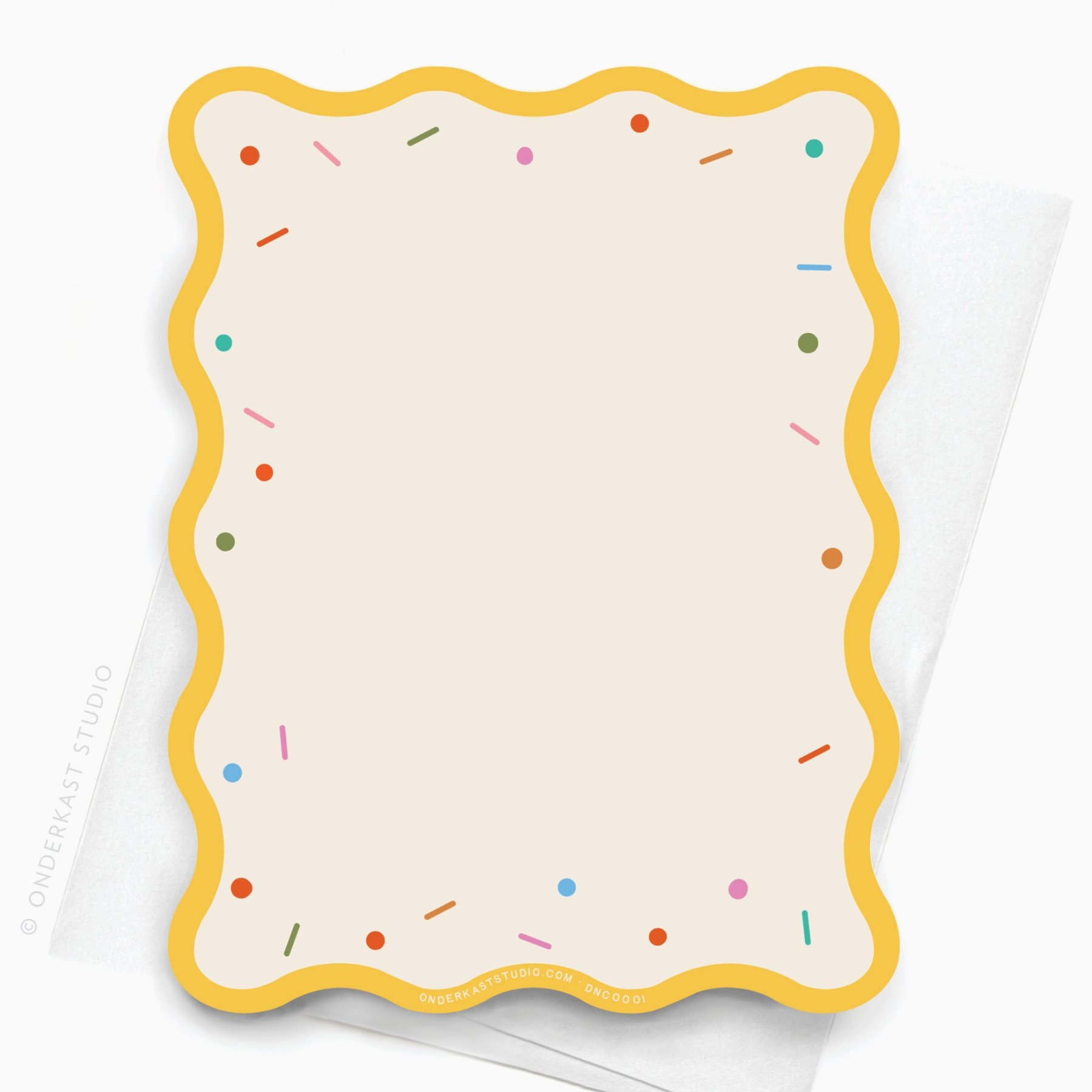 The back of a sprinkles themed notecard with scallop border and sprinkles along the edge