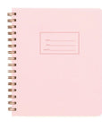 A light pink notebook with ring binding
