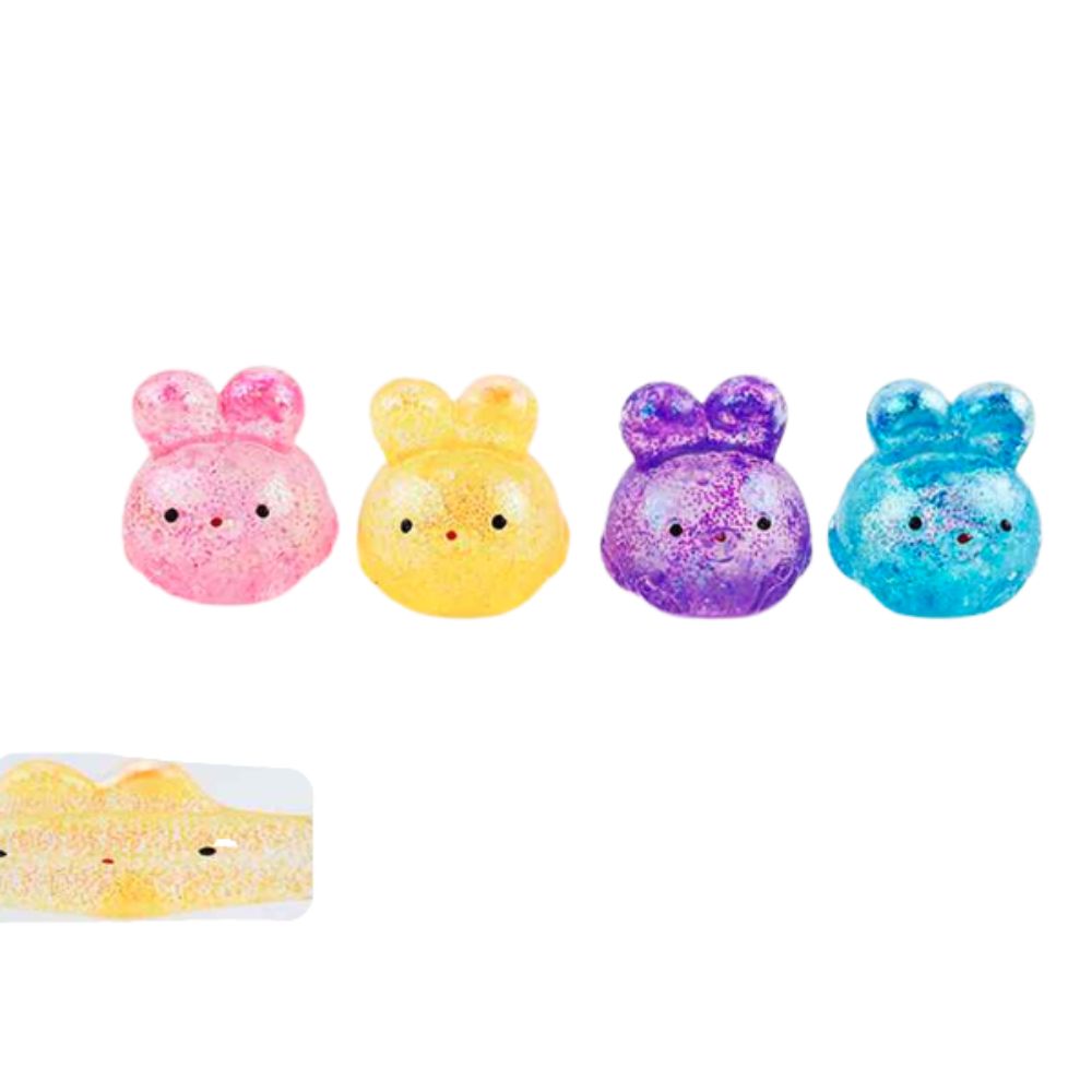 Four small bunny-shaped glitter squishies in pink, yellow, purple, and blue, shown on a white background with a close-up inset of the yellow one.