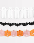 Halloween-themed decorative banner with pumpkins, bats, and candles on a white background