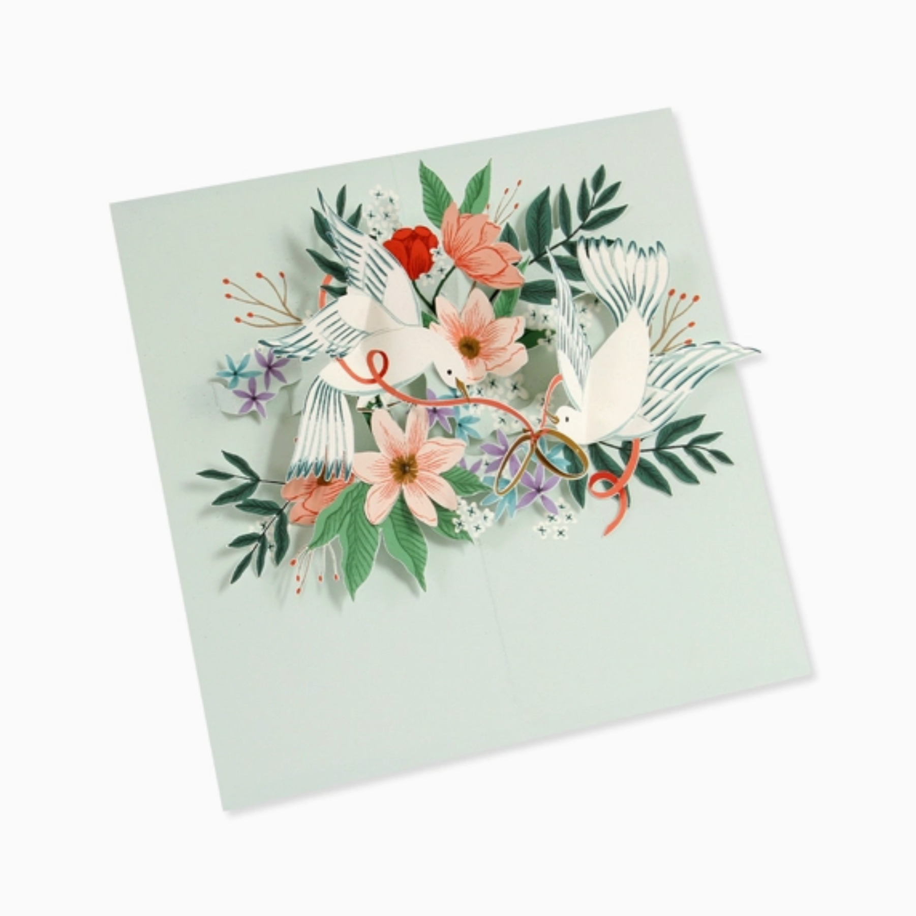 A pop-up design featuring a pair of white doves tied together with golden hoops, surrounded by floral elements