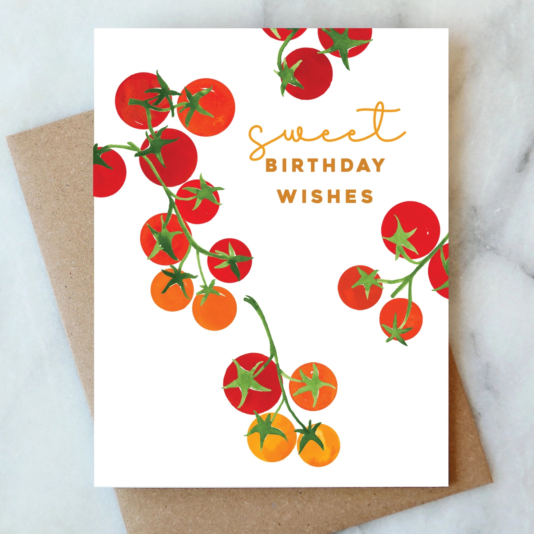 Greeting card with tomato illustrations and 'sweet birthday wishes' text on a marble surface.