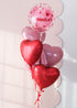 Clear bubble balloon with playful hearts with 5 heart balloons underneath