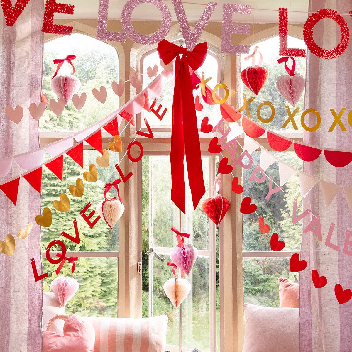 Decorative window with 'LOVE' and heart shapes for Valentine's Day.