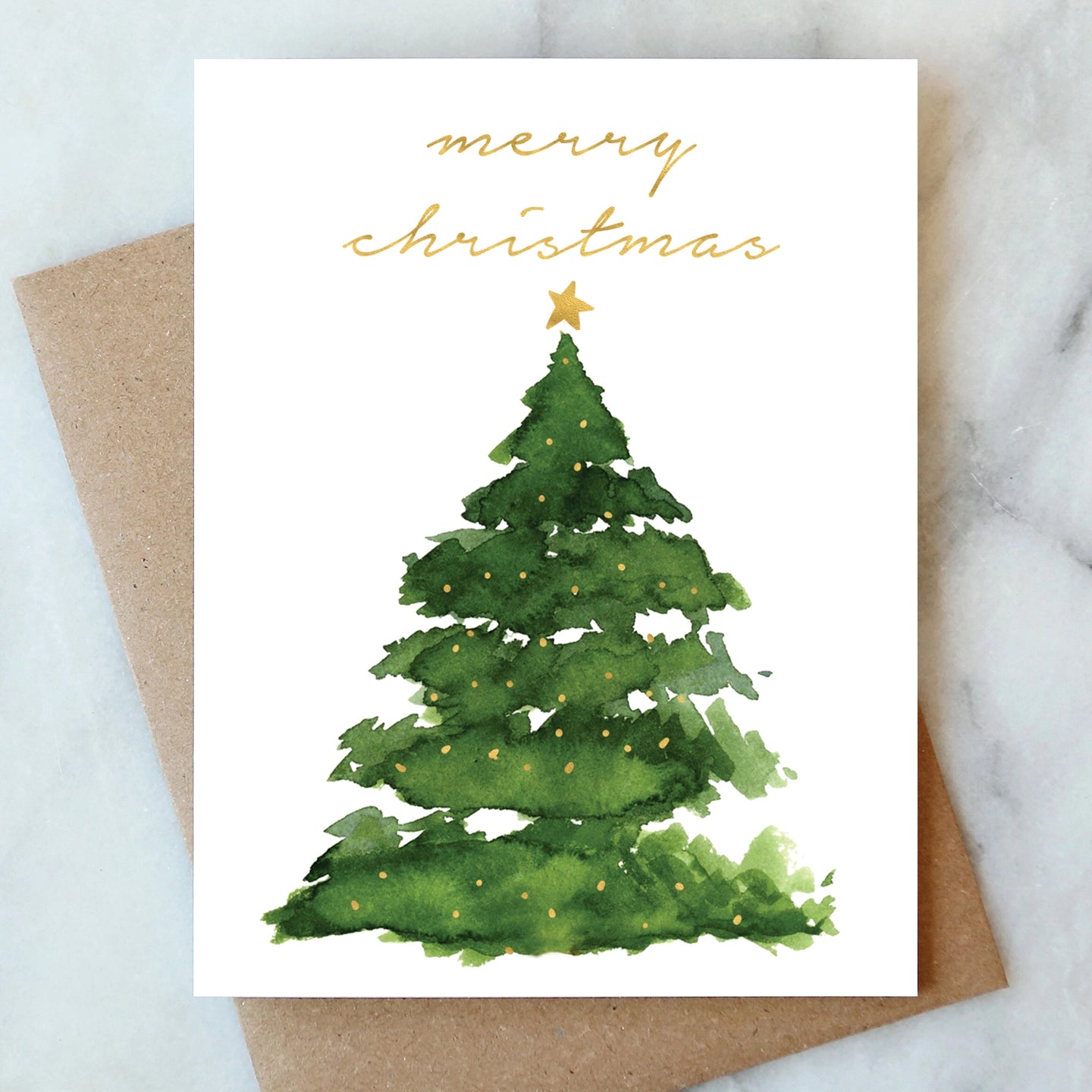 Christmas card with a green watercolor tree and 'Merry Christmas' text on a white background.