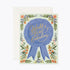 Card featuring merit ribbon of "world's best grandma" with floral pattern