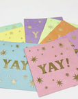 paper napkins with 'YAY!' text and decorated with tiny gold stars