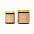 Two candles with gold lids and 'you're my person' text on a white background