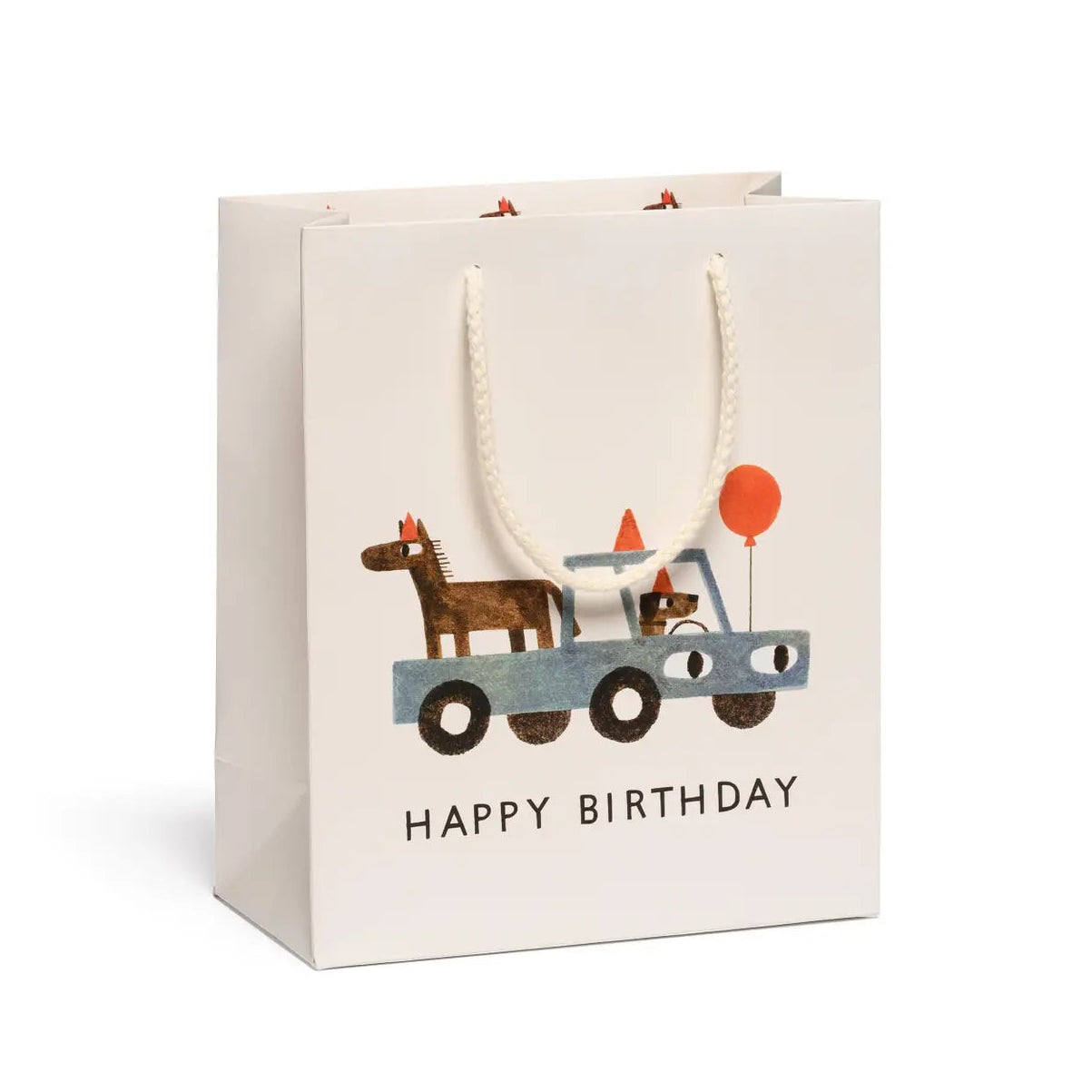 tan gift bag with illustration of blue car with dog, horse, and red balloon