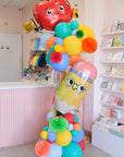 colorful balloon tower with school themed elements