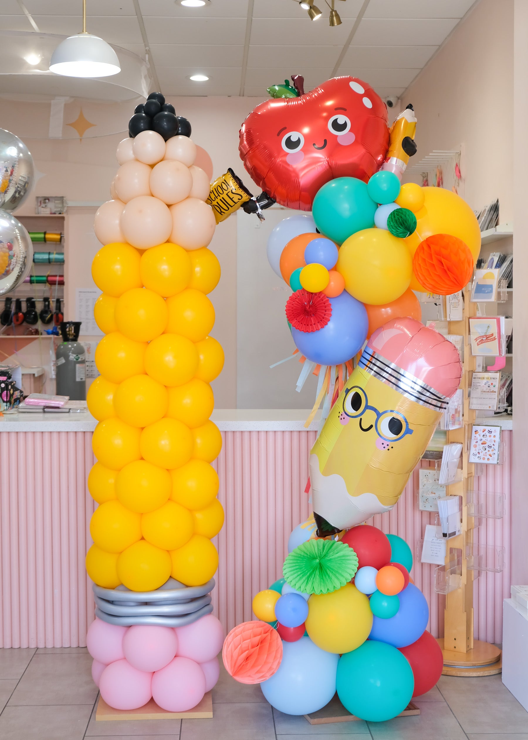pencil column and deluxe balloon tower with back to school themed shapes