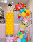 pencil column and deluxe balloon tower with back to school themed shapes
