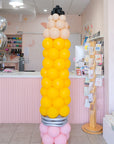 a 82" tall pencil balloon tower